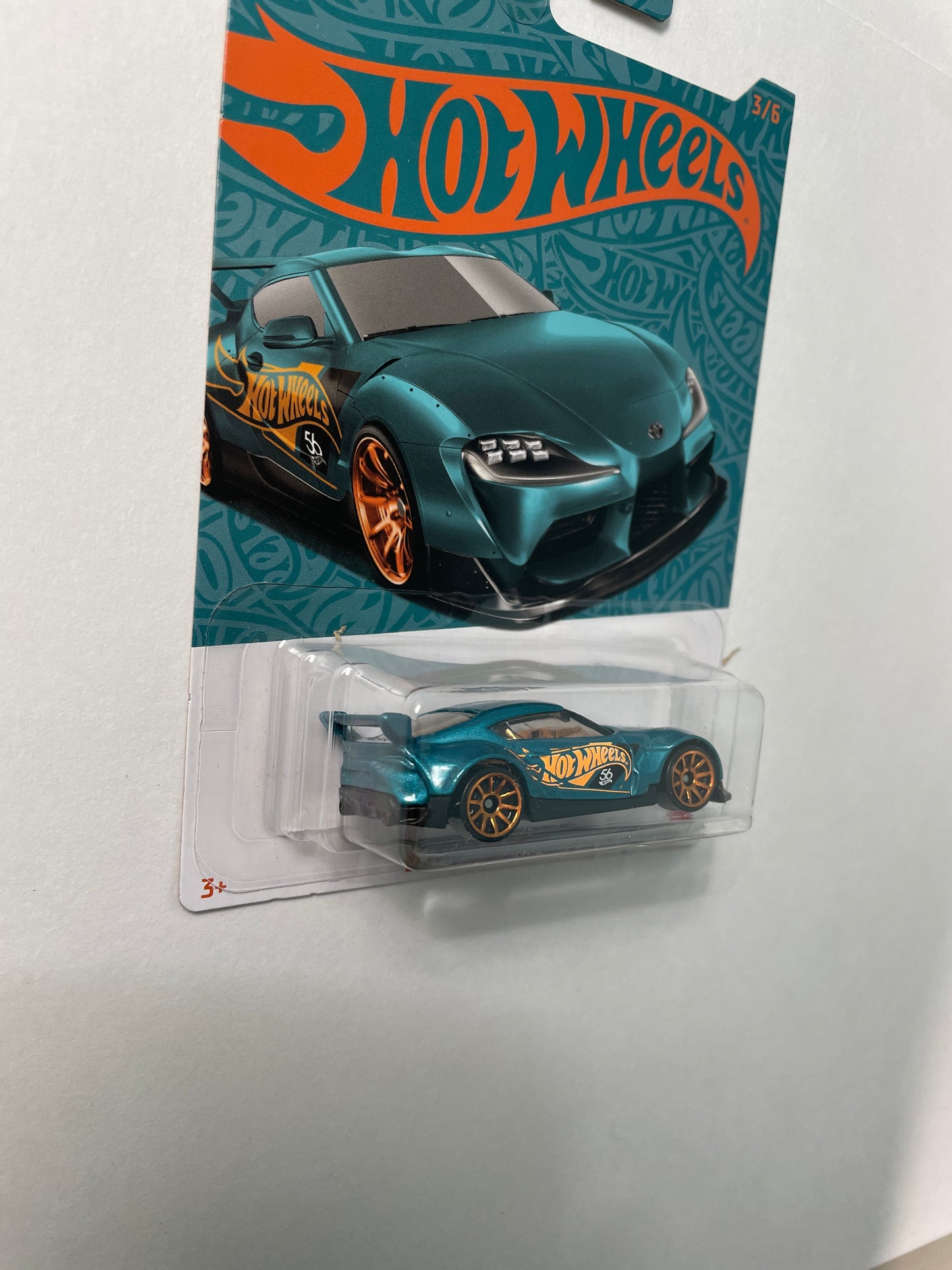 Hot Wheels 1/64 Pearl & Chrome ‘20 Toyota GR Supra Teal & Gold - Damaged Card
