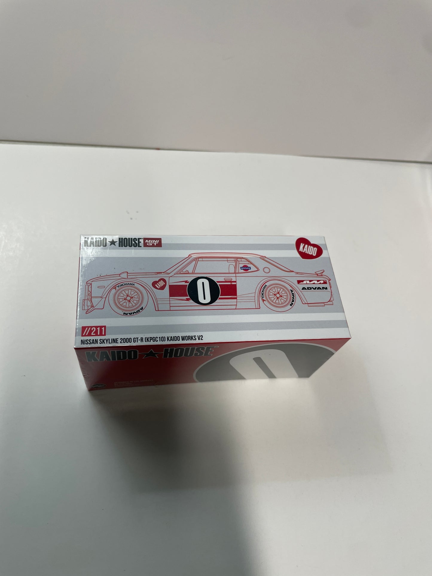 Mini GT x Kaido House 1/64 Nissan Skyline 2000GT-R (KPGC10) Kaido Works V2 White & Red - KHMG211