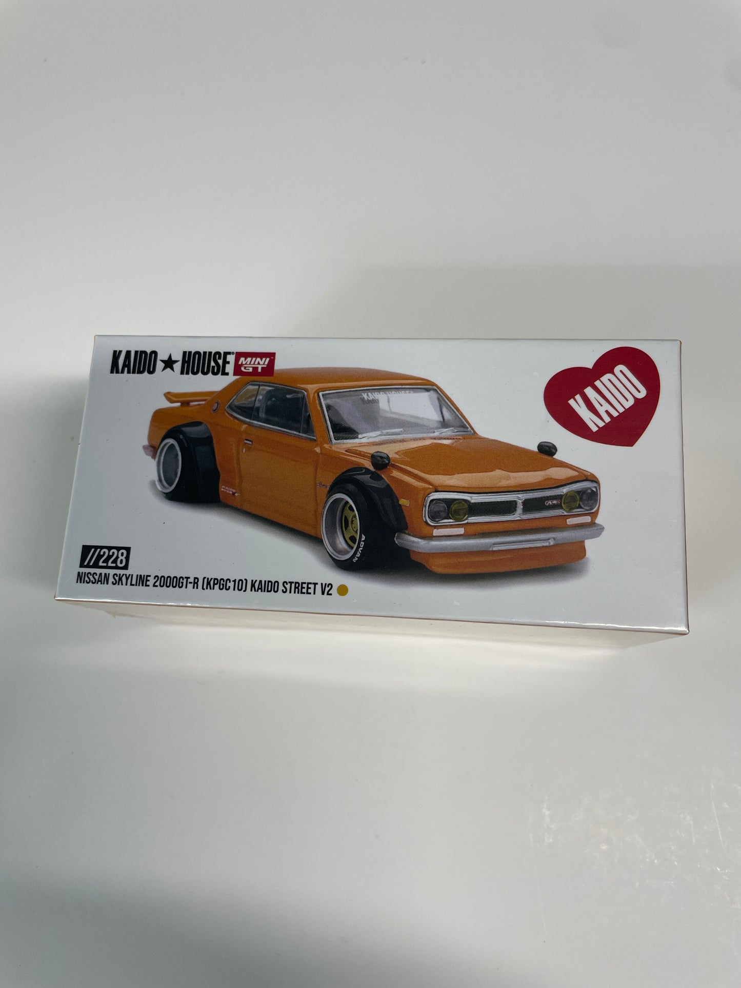 Mini GT x Kaido House 1/64 Nissan Skyline 2000 GT-R (KPGC10) Kaido Street V2 Orange - KHMG228