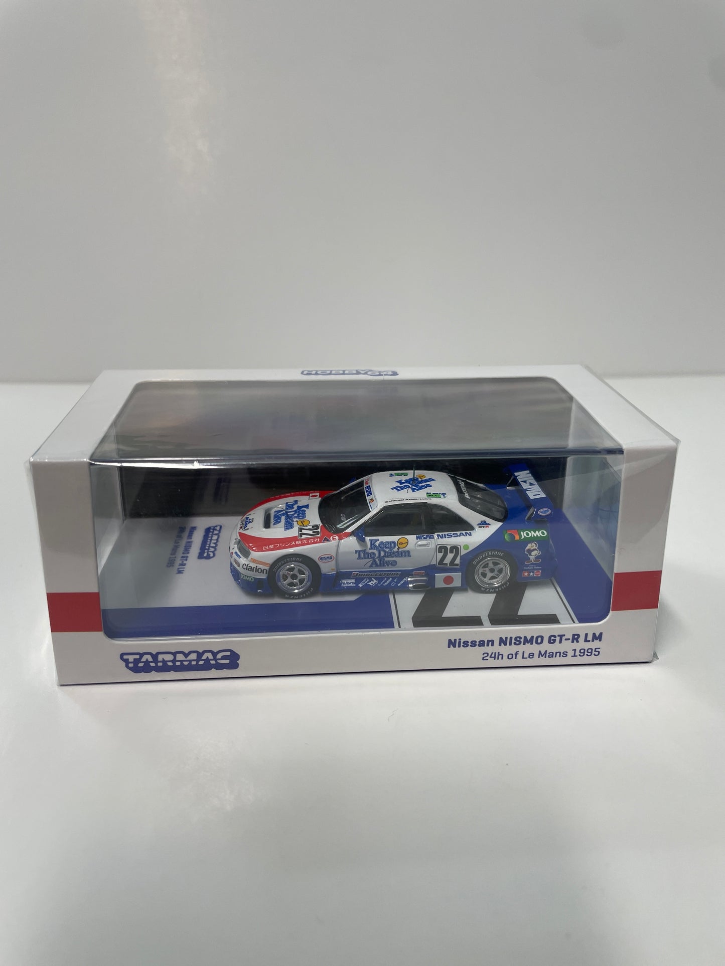 Tarmac Works 1/64 Nissan NISMO GT-R LM 24h of Le Mans 1995 n22 - HOBBY64 White & Blue - T64-067-95LM22