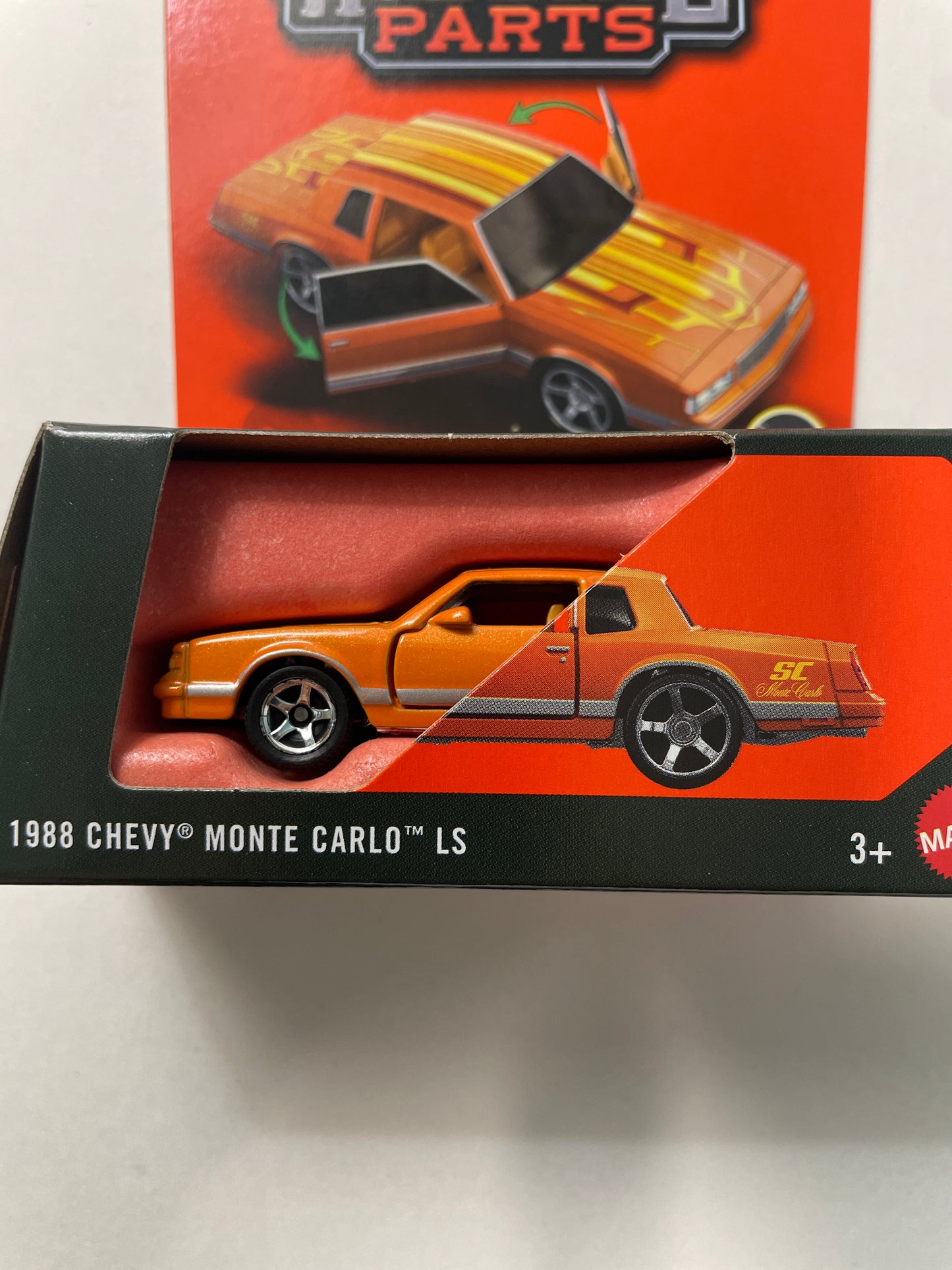 *Super Chase* Matchbox 1/64 Moving Parts 1988 Chevy Monte Carlo LS Orange