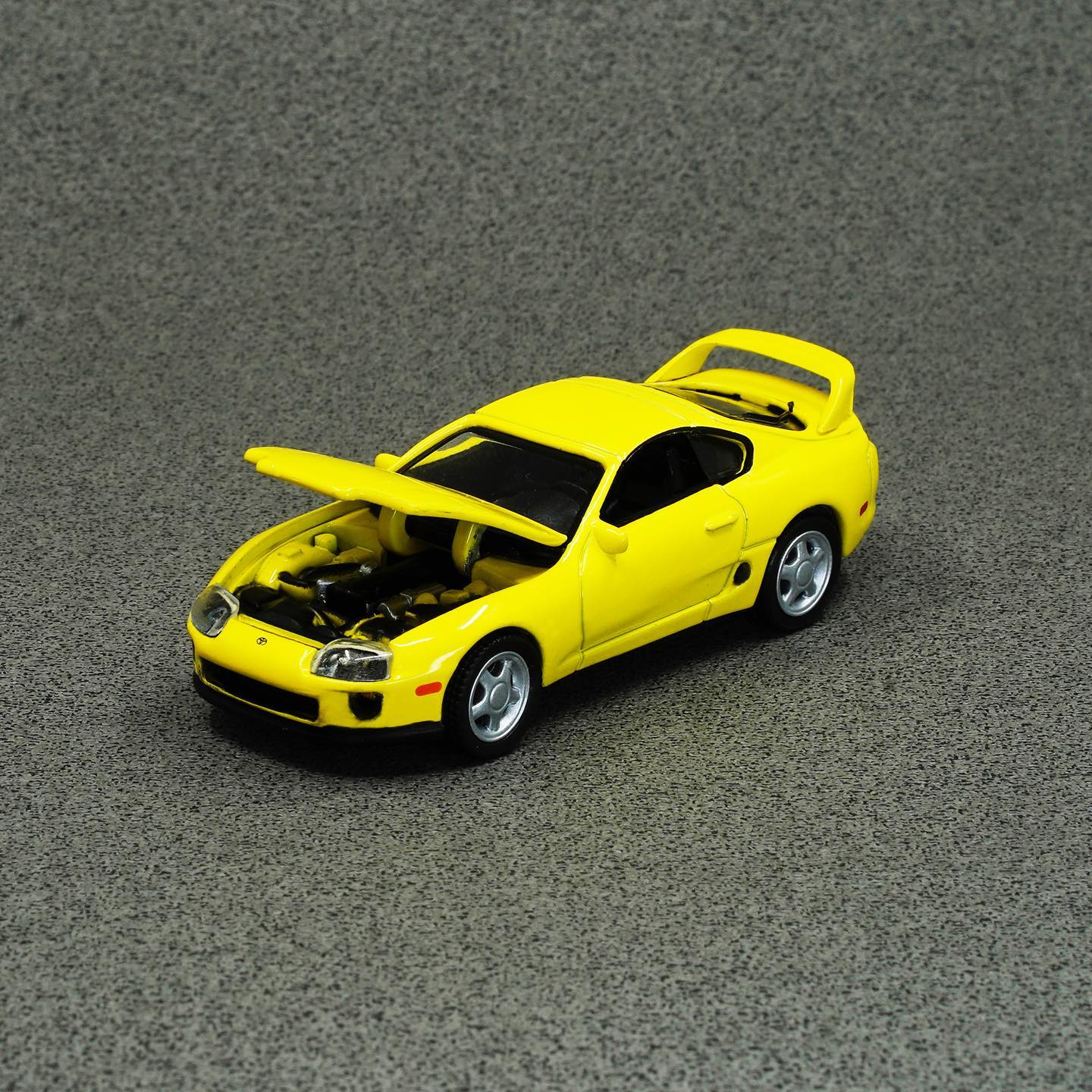 Auto World 1/64 1996 Toyota Supra Yellow Asia Special Edition