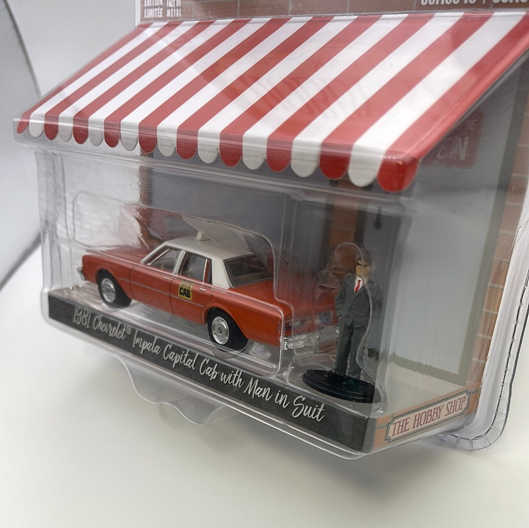1/64 Greenlight The Hobby Shop Series 15 1981 Chevrolet Impala Capital Cab w/ Man In Suit Orange