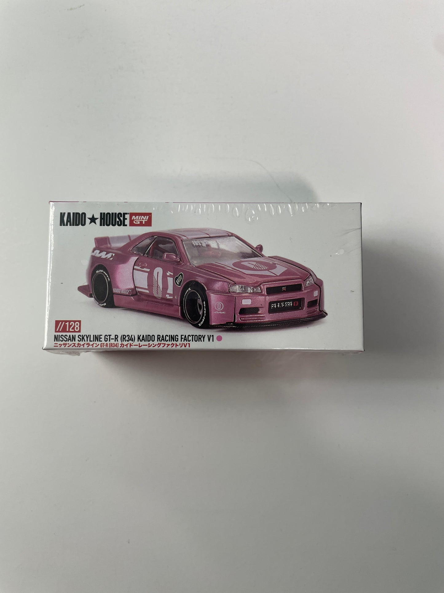 Mini GT x Kaido House 1/64 Nissan Skyline GT-R (R34) Kaido Racing Factory V1 Pink