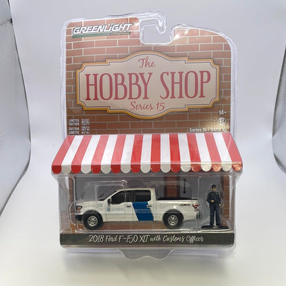 1/64 Greenlight The Hobby Shop Series 15 2018 Ford F-150 XLT w/ Customs Officer White