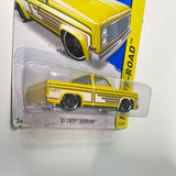 Hot Wheels 1/64 ‘83 Chevy Silverado Yellow - Damaged Card