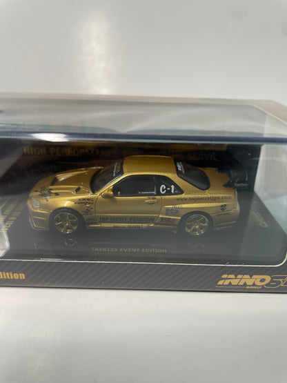 Inno64 1/64 2026 Tokyo Auto Salon TASKL25 Event Edition Nissan Skyline GT-R (R34) Gold -IN64-R34TSTH-TASKL25