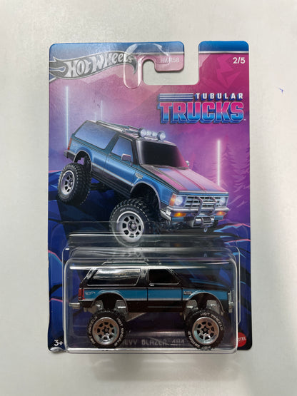 Hot Wheels 1/64 Tubular Trucks Chevy Blazer 4X4 Black & Blue - HRR96 - Damaged Card