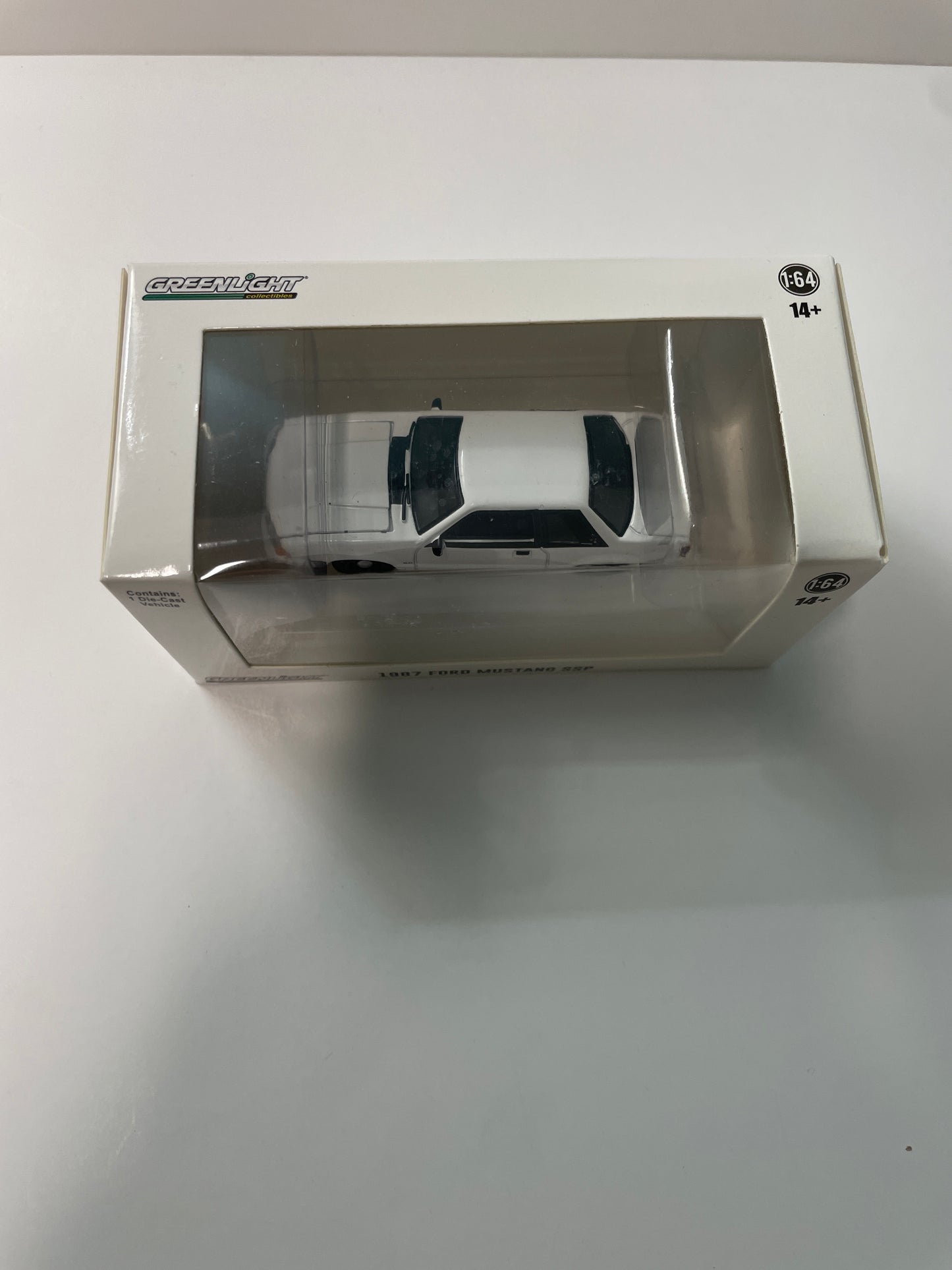 Greenlight 1/64 Hot Pursuit 1987 Ford Mustang SSP White