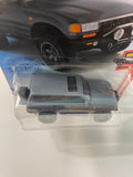 Hot Wheels 1/64 Toyota Land Cruiser 80 Grey - Damaged Card