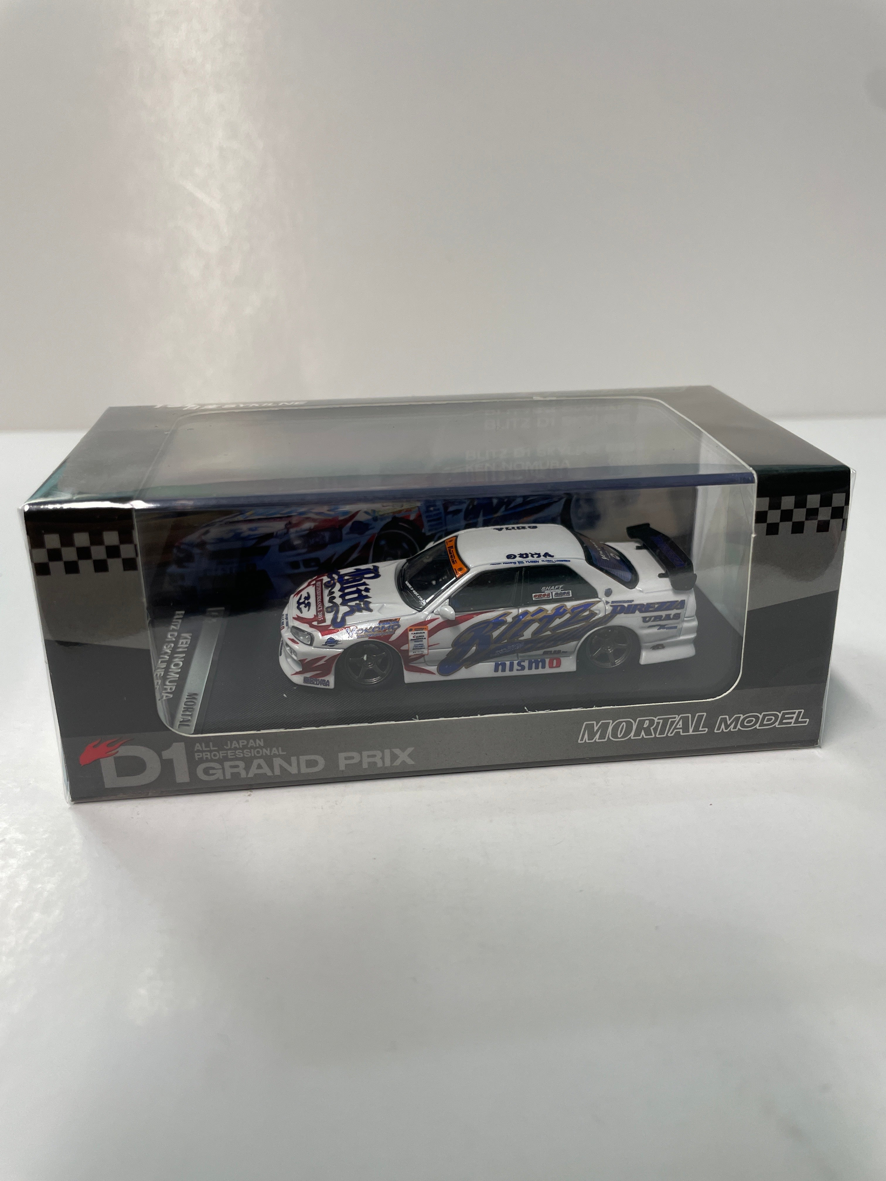 Mortal Model 1/64 Nissan Skyline Blitz D1 ER34 2005 White – Flipn