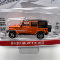 Greenlight Hollywood 1/64 Cold Pursuit 2010 Jeep Wrangler Unlimited  Orange