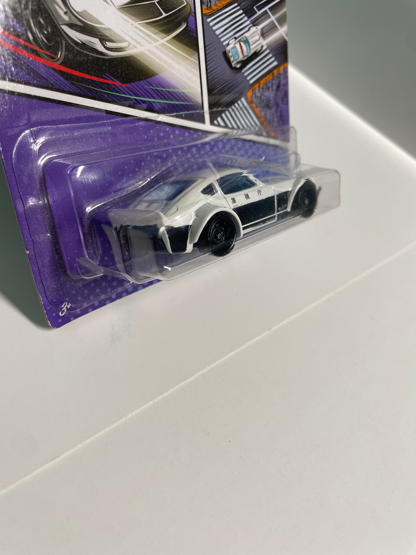 Hot Wheels 1/64 Nissan Fairlady Z Police White & Black - Damaged Card