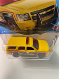 Hot Wheels 1/64 ‘07 Chevy Tahoe Yellow - Damaged Card