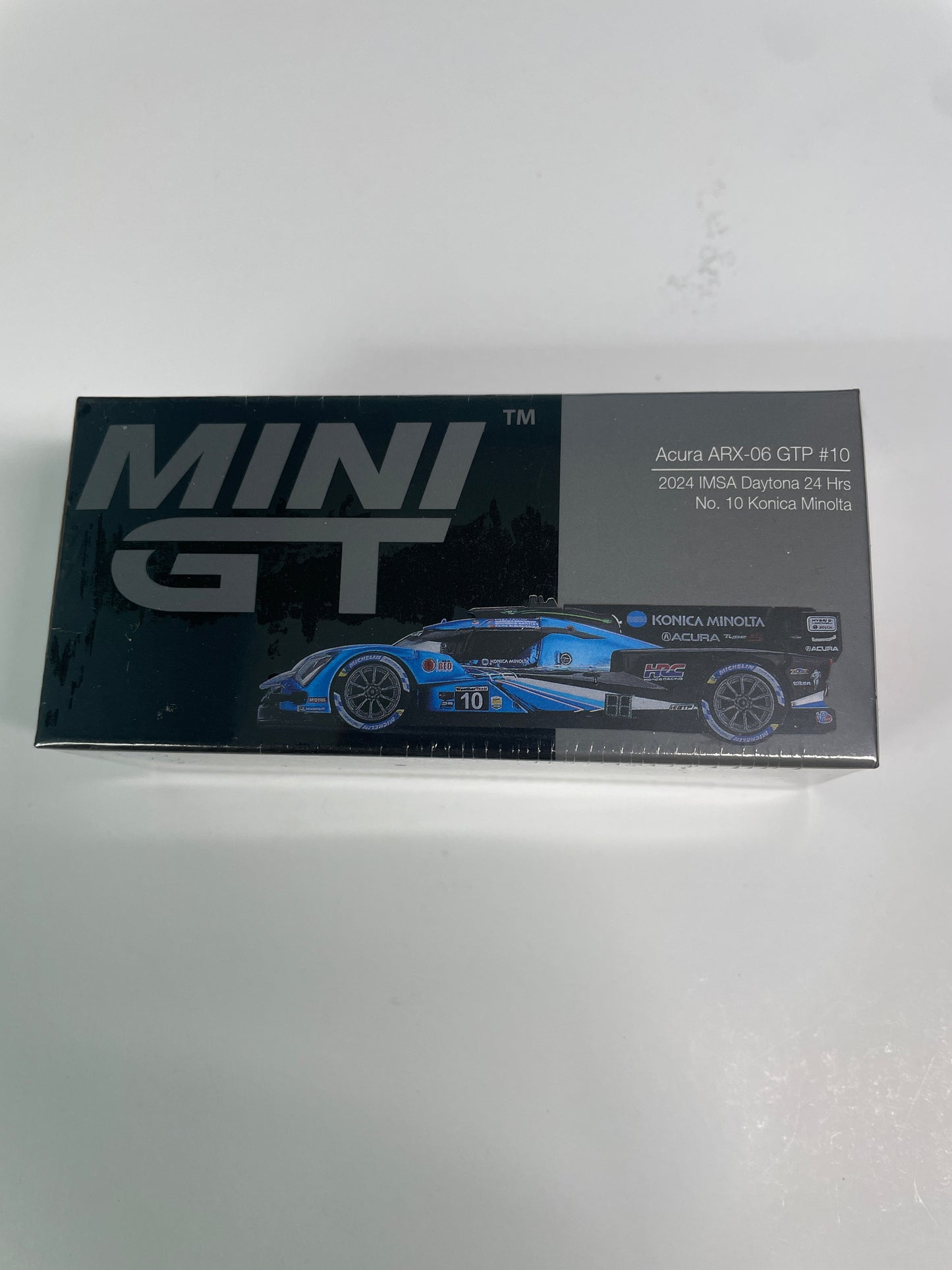 Mini GT 1/64 Acura ARX-06 GTP #10 2024 IMSA Daytona 24 Hrs Konica Minolta Black & Blue - MGT01056