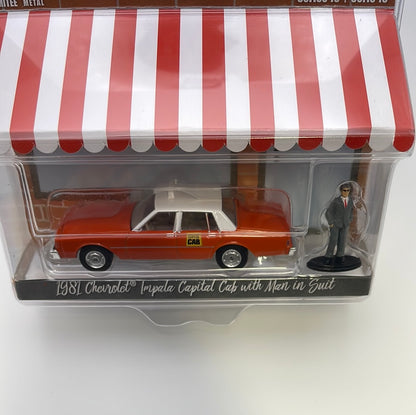 1/64 Greenlight The Hobby Shop Series 15 1981 Chevrolet Impala Capital Cab w/ Man In Suit Orange