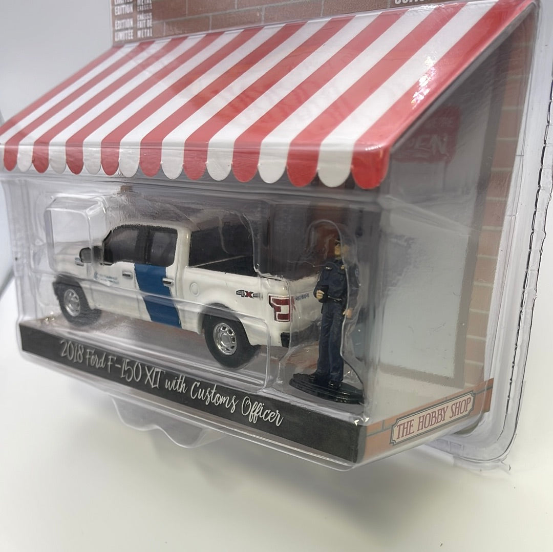1/64 Greenlight The Hobby Shop Series 15 2018 Ford F-150 XLT w/ Customs Officer White