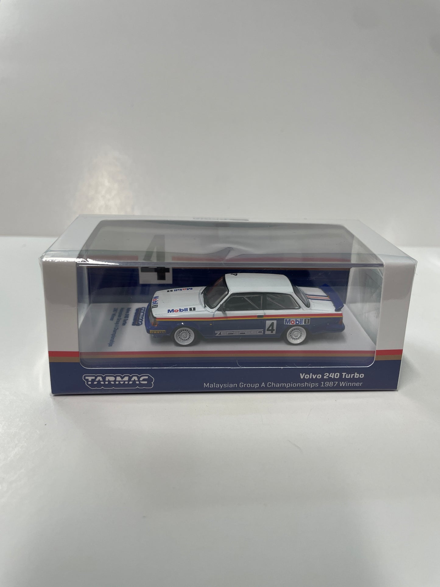 Tarmac Works 1/64 Volvo 240 Turbo Malaysian Group A Championships 1987 Winner n4 - HOBBY64 White & Blue - T64-050-87MAL04