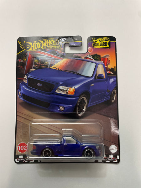 Hot Wheels 1/64 Boulevard Mix W ‘99 Ford F-150 SVT Lightning Blue - Damaged Card