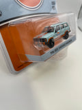 Greenlight 1/64 Gulf 1986 Jeep Cherokee Wagoneer Orange & Blue