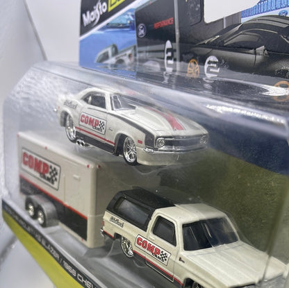 Maisto Design 1/64 Team Haulers 1979 Chevrolet K5 Blazer/ 1968 Chevrolet Camaro Z/28 White - Damaged Card