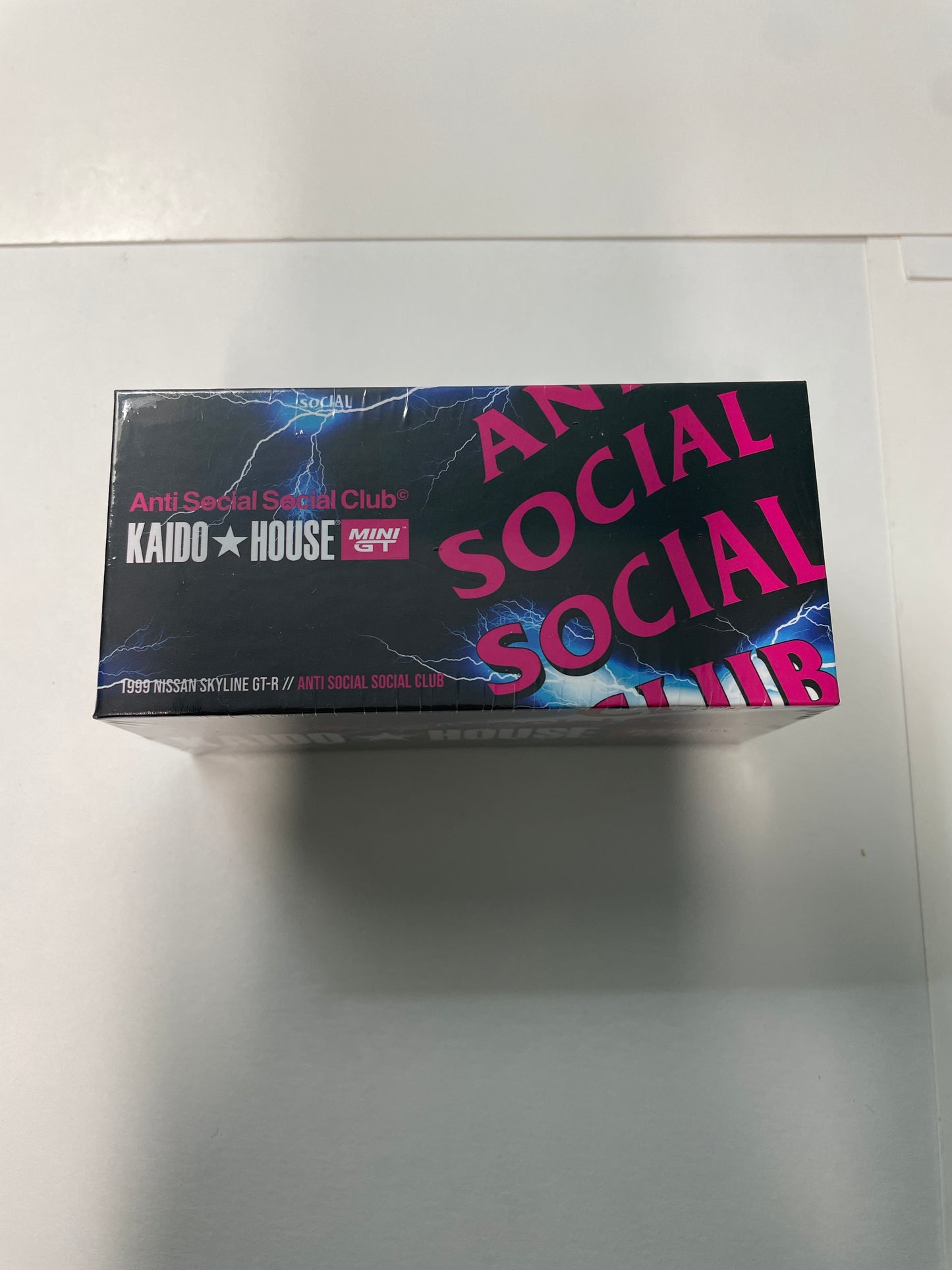 Mini GT x Kaido House 1/64 2026 Tokyo Auto Salon Anti Social Social Club 1999 Nissan Skyline GT-R (R34) V1 & Flag - KHMG106