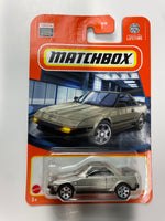 Matchbox 1/64 1984 Toyota MR2 Gold - Damaged Card