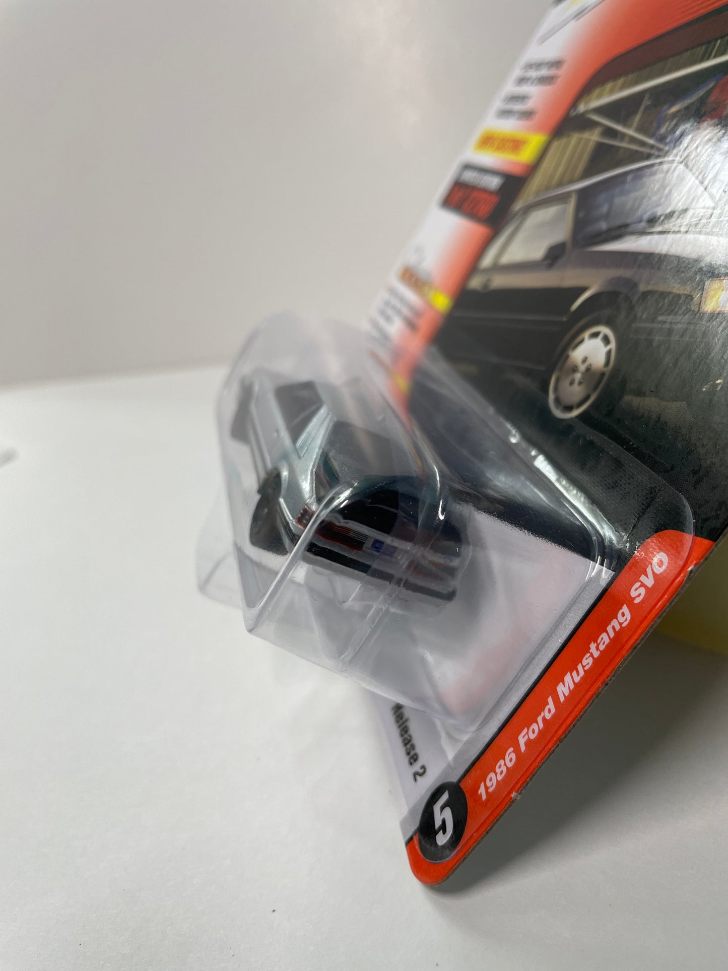 Johnny Lightning 1/64 1986 Ford Mustang SVO Classic Gold Collection Version B Silver - Damaged Card