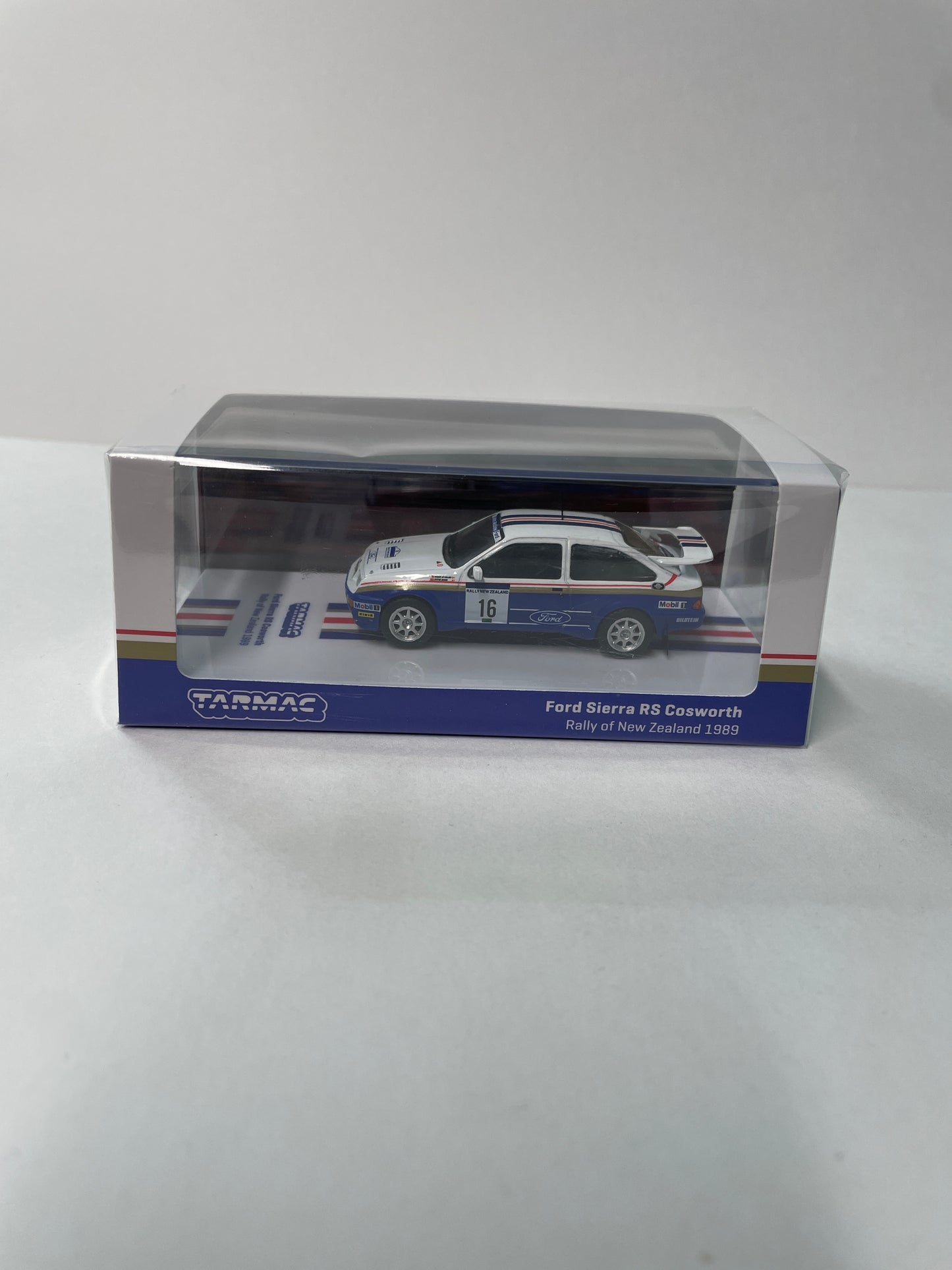 Tarmac Works 1/64 Ford Sierra RS Cosworth Rally of New Zealand 1989 #16 - HOBBY64 White & Blue