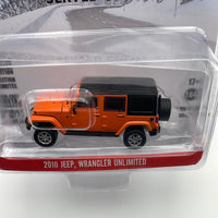 Greenlight Hollywood 1/64 Cold Pursuit 2010 Jeep Wrangler Unlimited  Orange