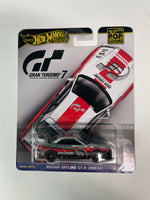 Hot Wheels 1/64 Pop Culture Gran Turismo 7 Nissan Skyline GT-R (BNR34) White & Black - Damaged Card