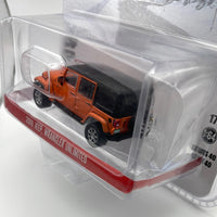 Greenlight Hollywood 1/64 Cold Pursuit 2010 Jeep Wrangler Unlimited  Orange