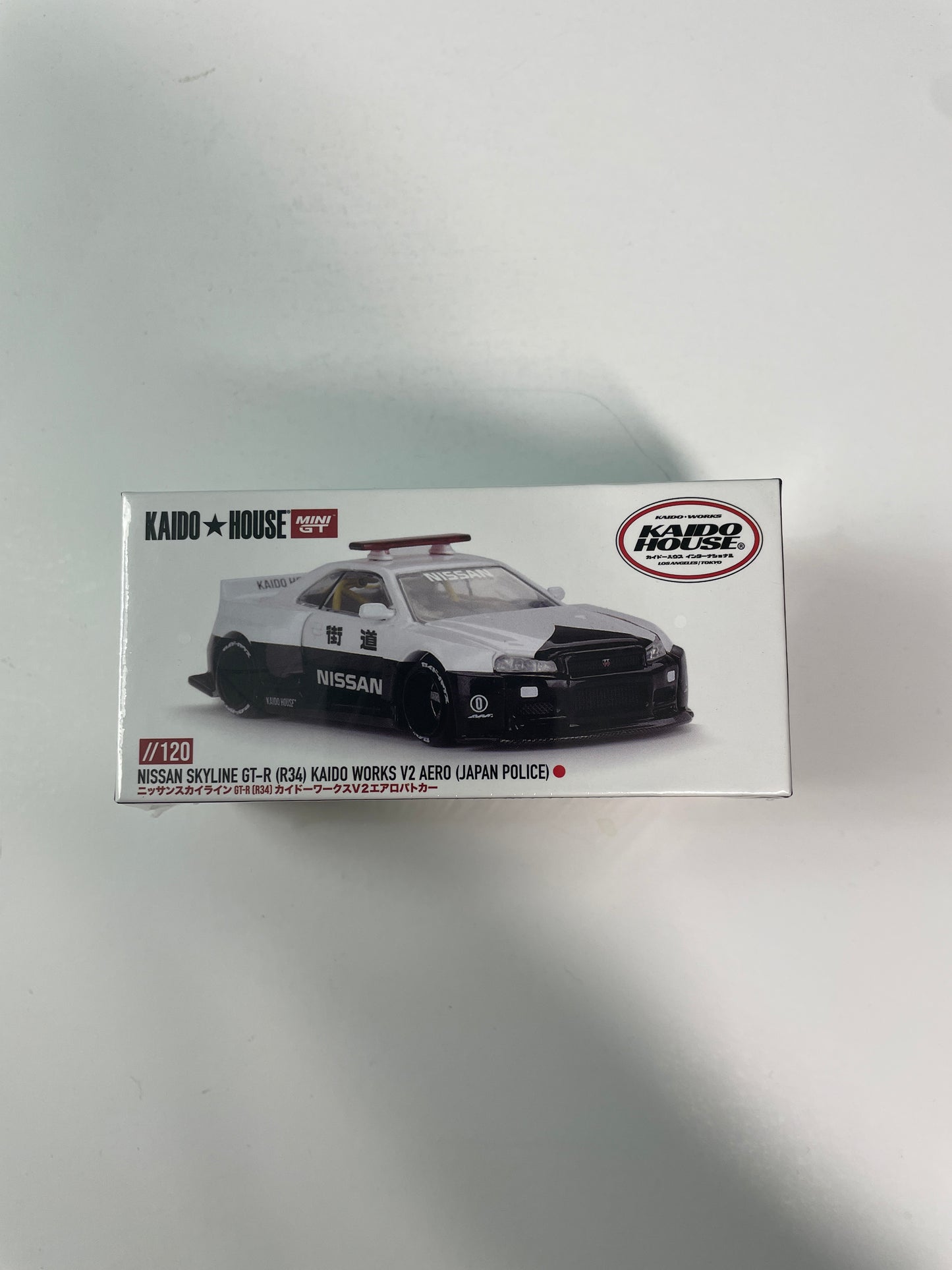 Mini GT x Kaido House 1/64 Nissan Skyline GT-R (R34) Kaido Works V2 Aero (Japan Police) Black & White