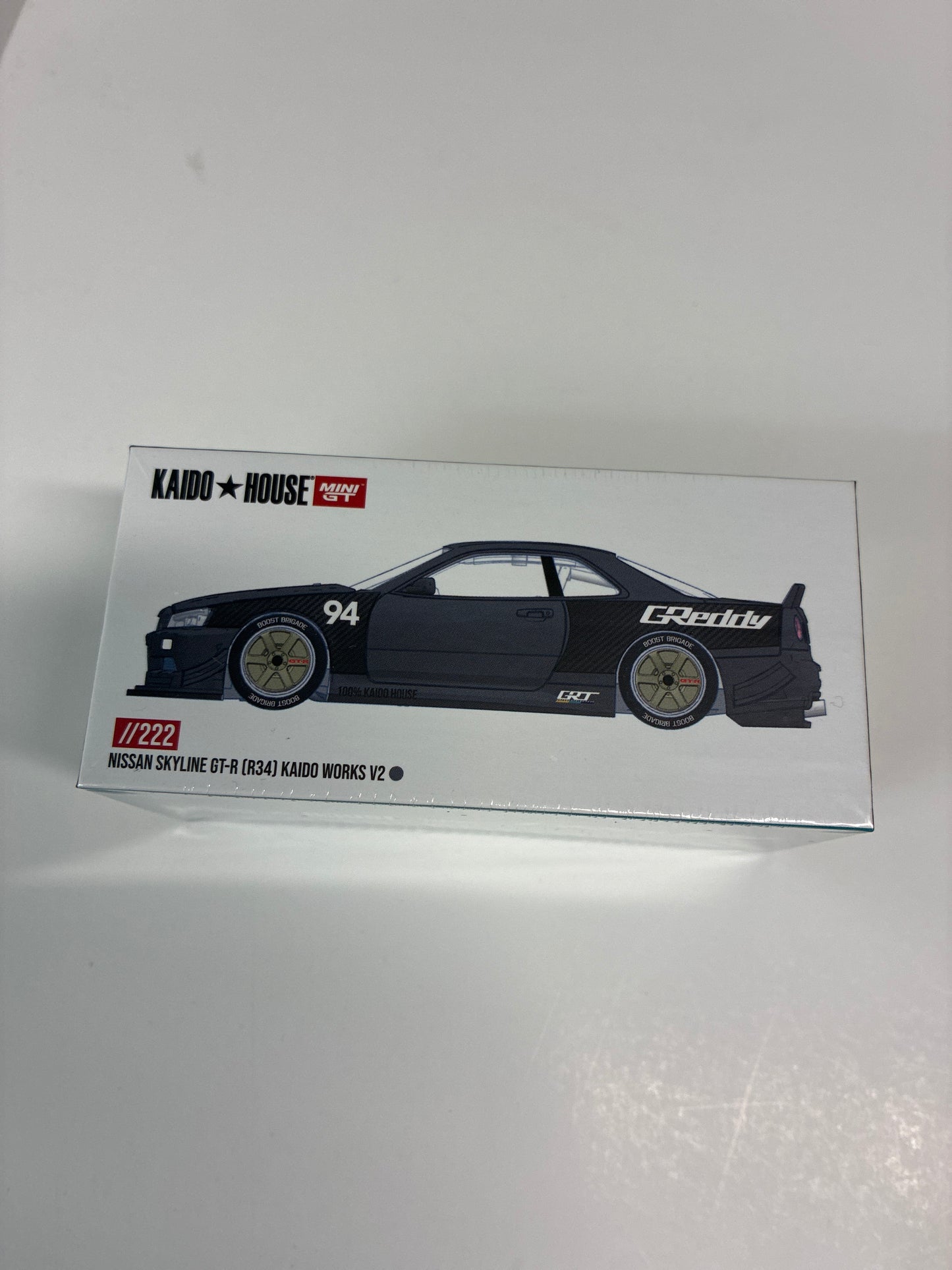Mini GT x Kaido House 1/64 Nissan Skyline GT-R (R34) Kaido Works GReddy V2 Black - KHMG222