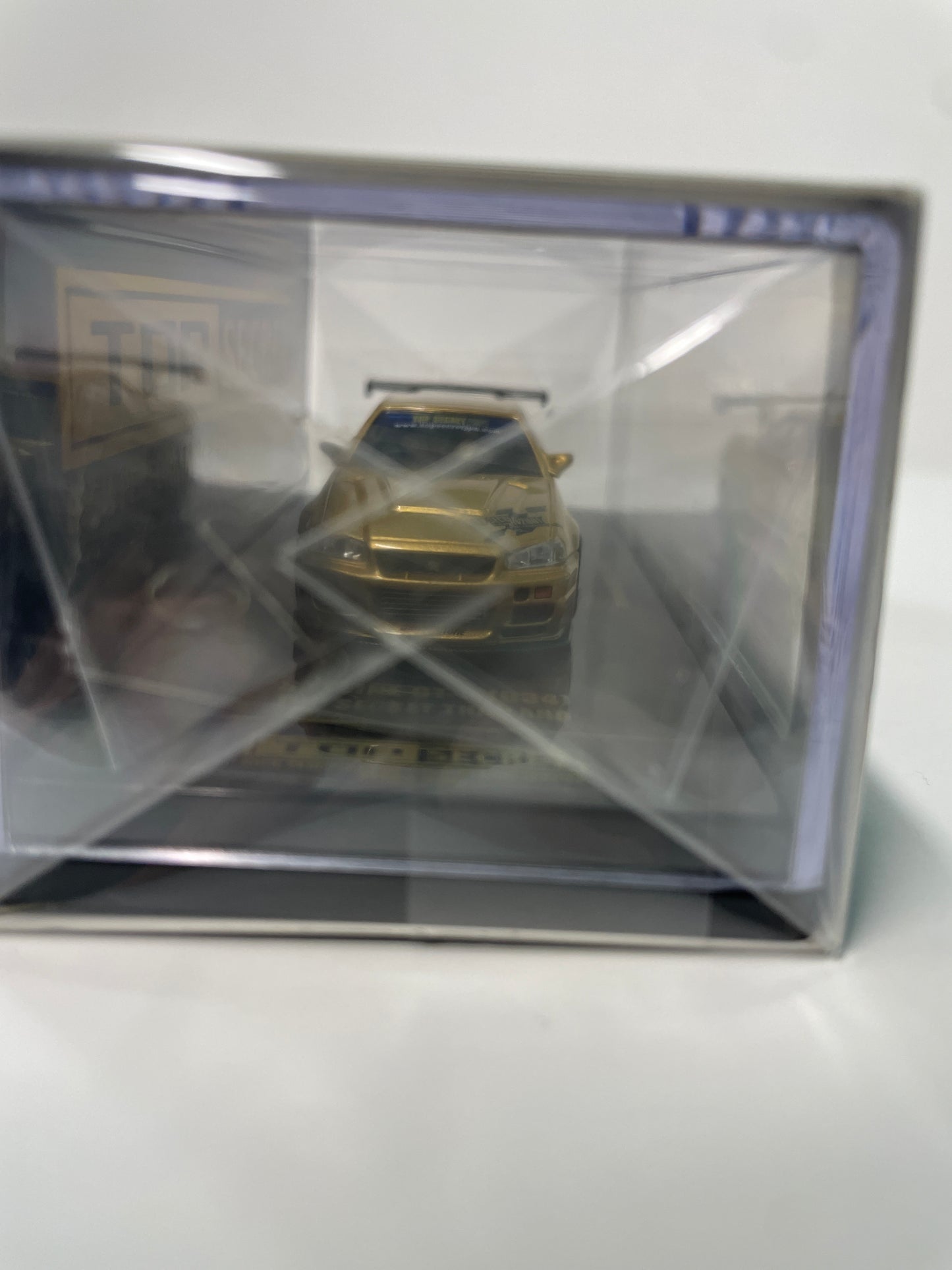 Inno64 1/64 2026 Tokyo Auto Salon TASKL25 Event Edition Nissan Skyline GT-R (R34) Gold -IN64-R34TSTH-TASKL25