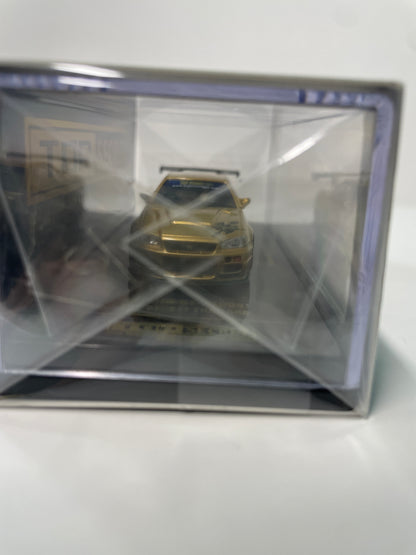 Inno64 1/64 2026 Tokyo Auto Salon TASKL25 Event Edition Nissan Skyline GT-R (R34) Gold -IN64-R34TSTH-TASKL25