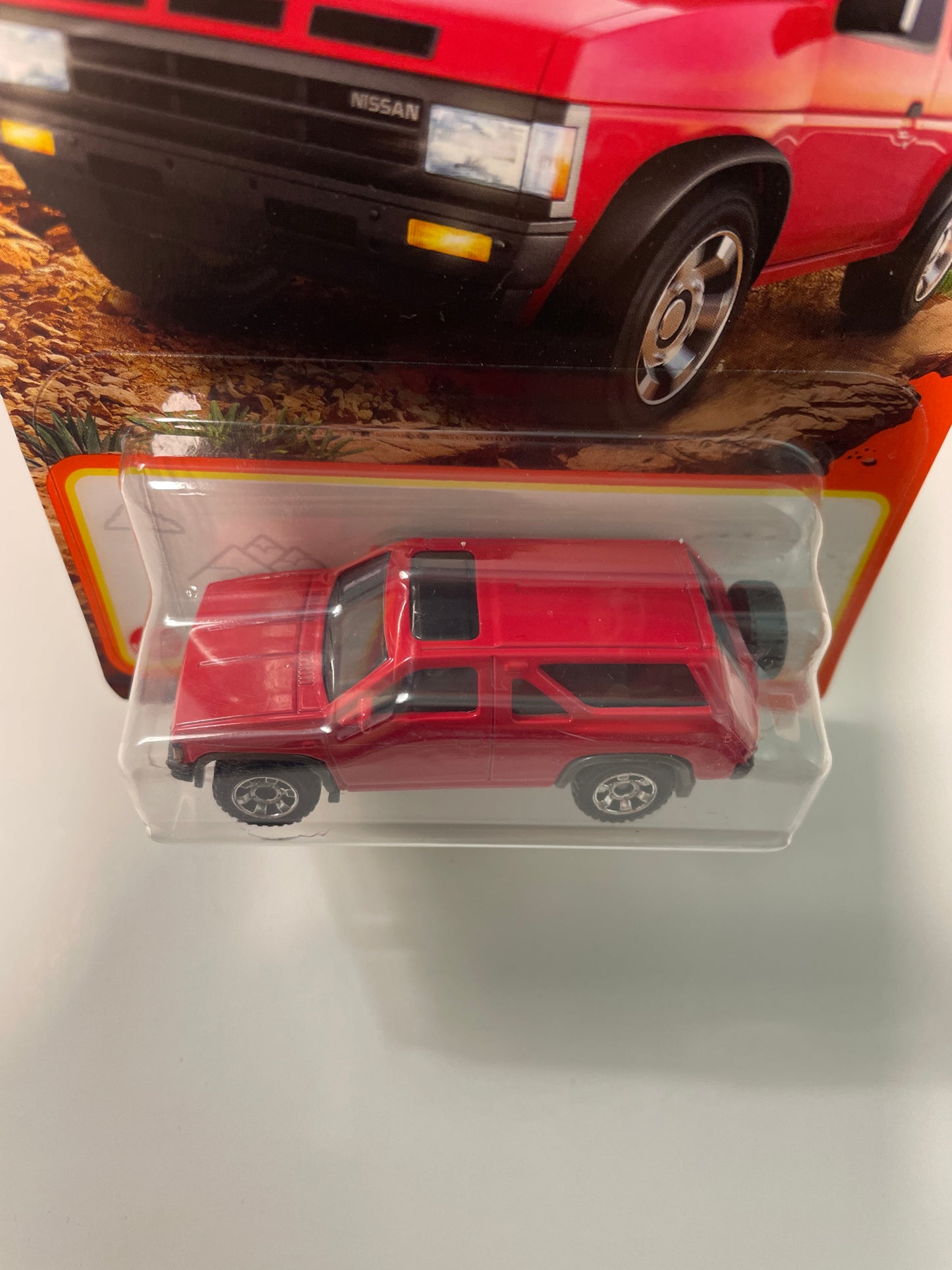 Matchbox 1/64 1985 Nissan Pathfinder Red - Damaged Card
