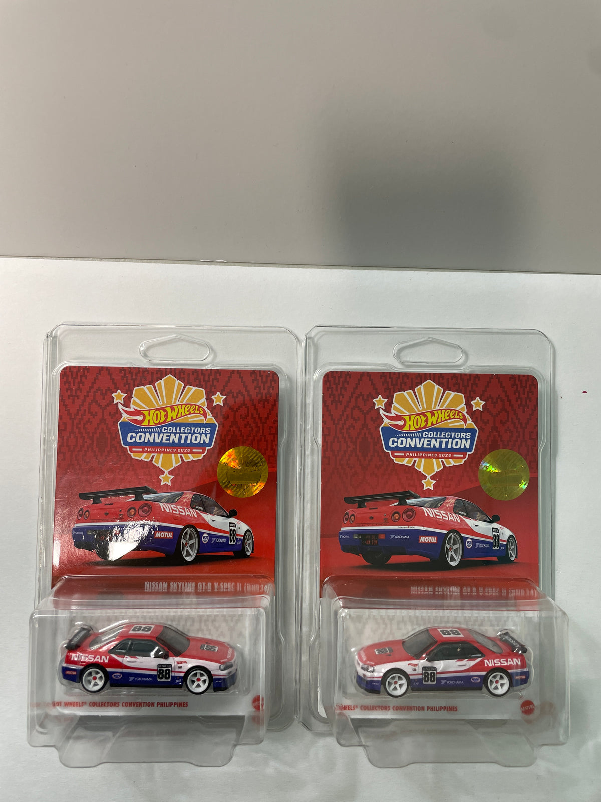 Hot Wheels 1/64 Collectors Convention Philippines 2026 Set Of 2 Nissan Skyline GT-R V-Spec II (BNR34) #182 Red/ Blue - JKC11-0910