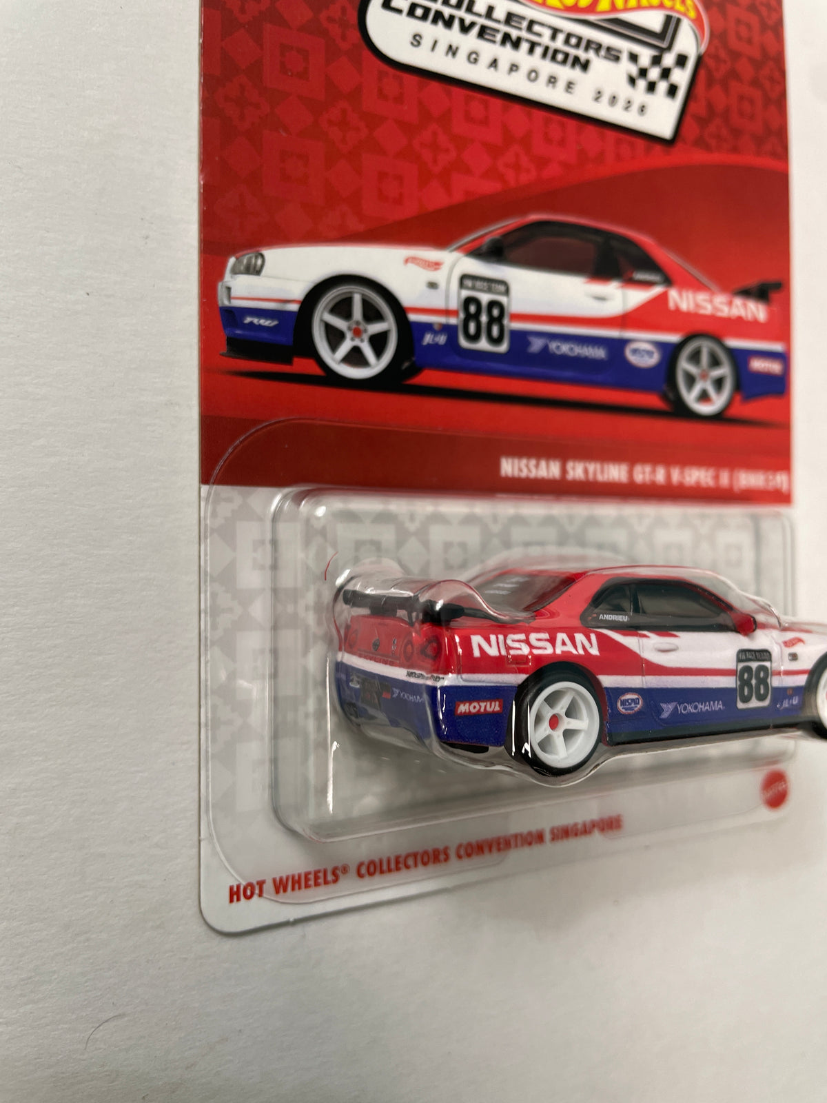 Hot Wheels 1/64 1st Annual Collectors Convention Singapore 2026 Nissan Skyline GT-R V-Spec II (BNR34) #599 Red / Blue - JKC12-0910