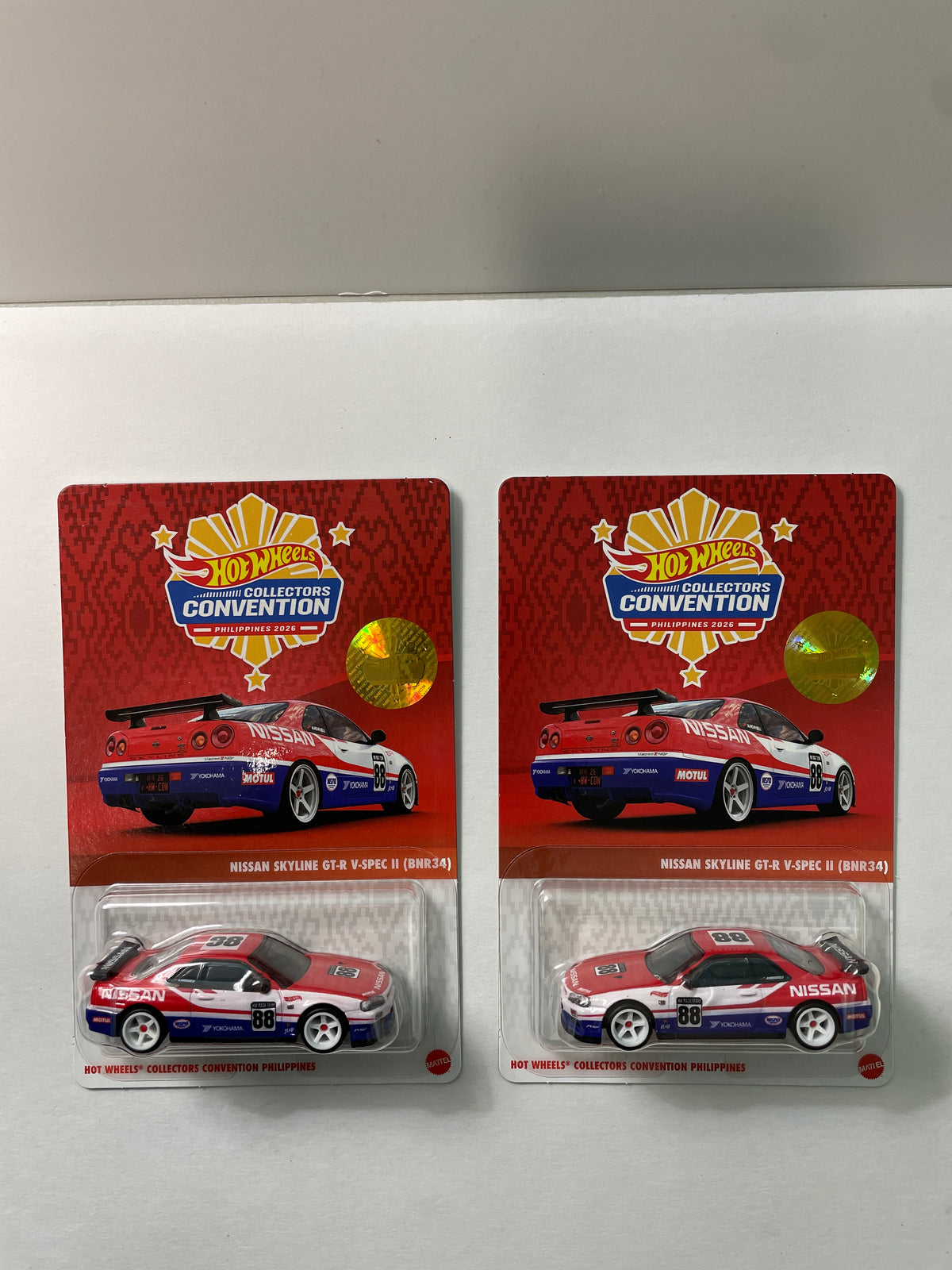 Hot Wheels 1/64 Collectors Convention Philippines 2026 Set Of 2 Nissan Skyline GT-R V-Spec II (BNR34) #182 Red/ Blue - JKC11-0910