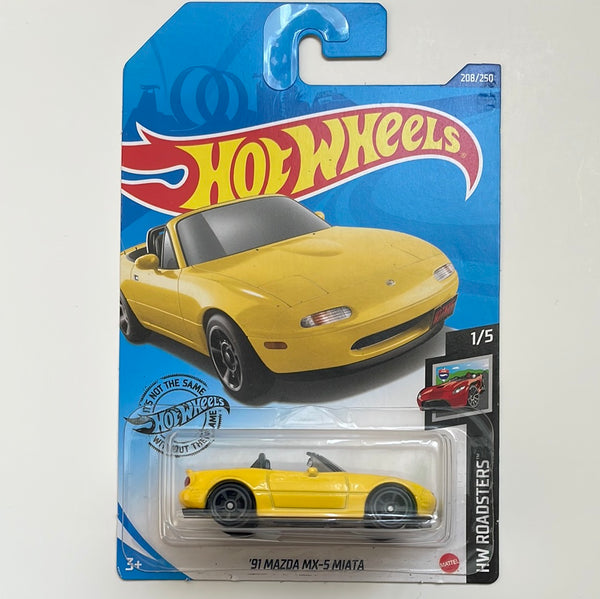 Hot Wheels 1/64 ‘91 Mazda MX-5 Miata Yellow - Damaged Card