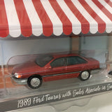 Greenlight 1/64 1989 Ford Taurus Red w/ Sales Associate in Suit