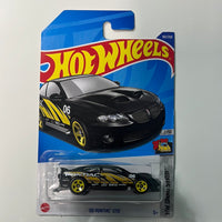 Hot Wheels ‘06 Pontiac GTO Black - Damaged Card